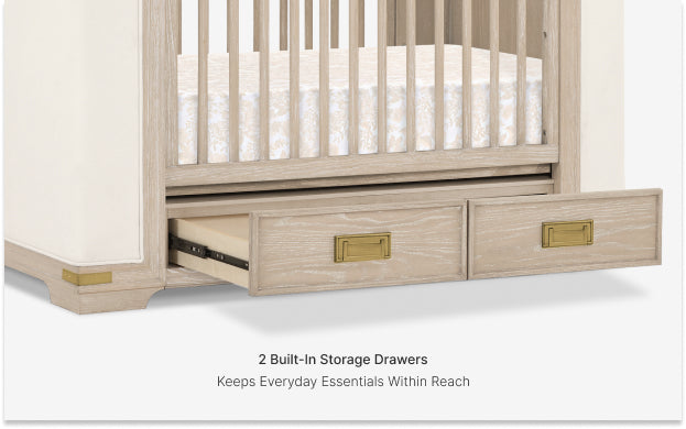 Wooden crib with two built-in storage drawers on a white background