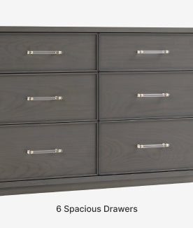 Gray dresser with six spacious drawers and metallic handles on a white background.