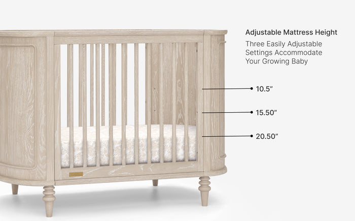 Wooden crib with adjustable mattress height markings on a white background