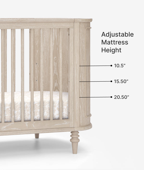 Wooden crib with adjustable mattress height labels on a white background
