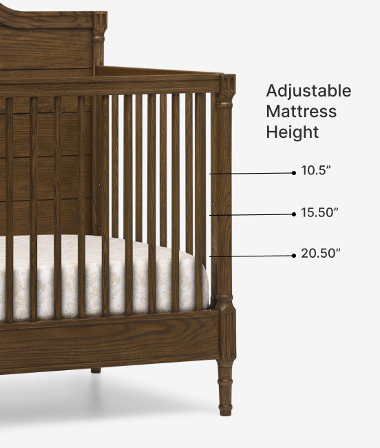 Wooden crib with adjustable mattress height markings on a white background