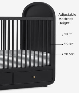 Black crib with adjustable mattress height labels on a white background