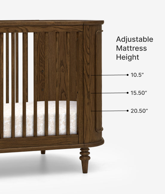 Wooden crib with adjustable mattress height labels on a white background