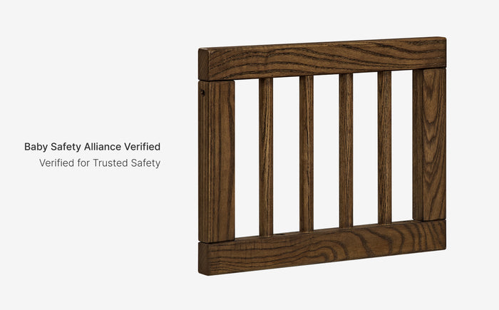 Wooden baby gate with 'Baby Safety Alliance Verified' text on a white background