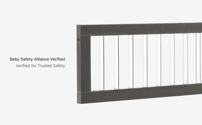 Gray metal railing with 'Baby Safety Alliance Verified' text on a white background
