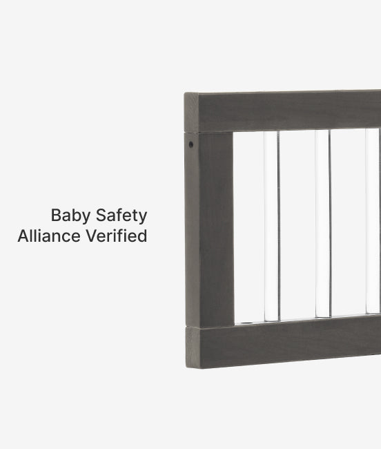 Metallic stair railing with 'Baby Safety Alliance Verified' text on a white background