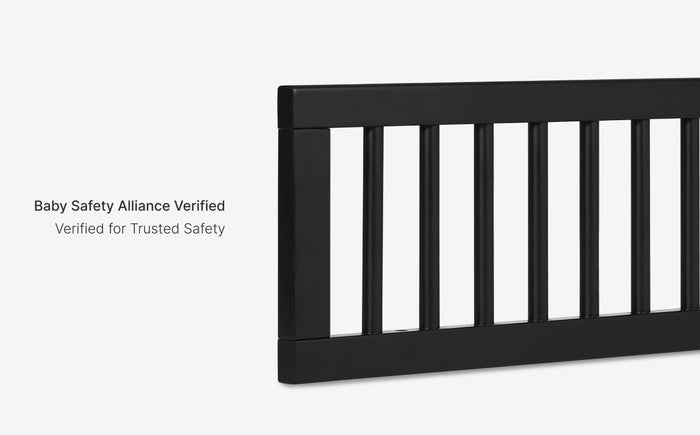 Black crib rail with 'Baby Safety Alliance Verified' text on a white background