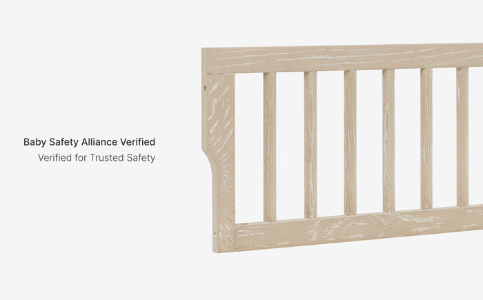 Wooden crib with 'Baby Safety Alliance Verified' text on a white background