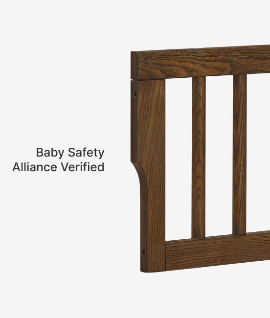 Wooden baby gate with 'Baby Safety Alliance Verified' label on a white background