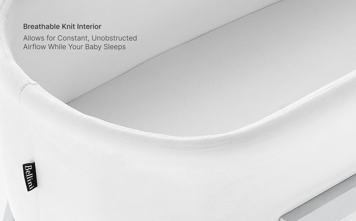 White crib mattress with breathable knit interior feature text