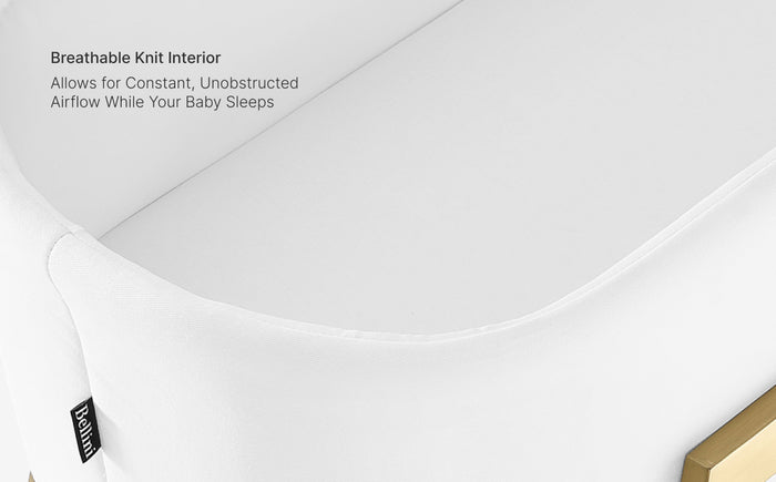 White crib sheet with text about breathable knit interior on a light gray background