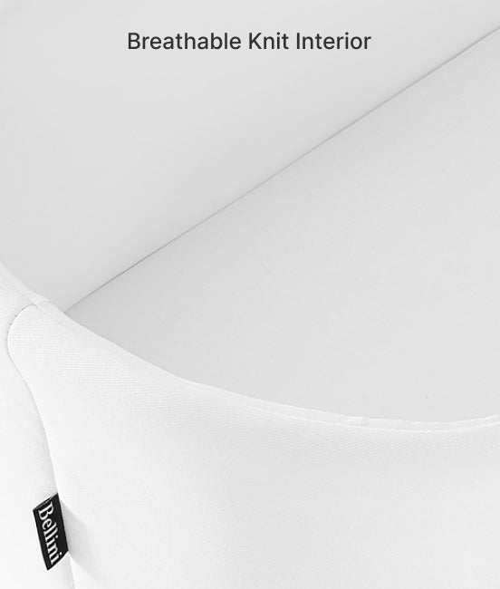 White pillow with breathable knit interior and a visible brand label on a white background.