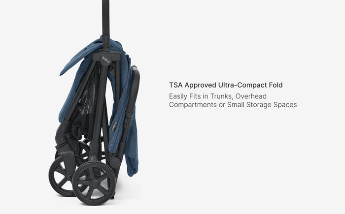 Compact folding suitcase with wheels on a white background