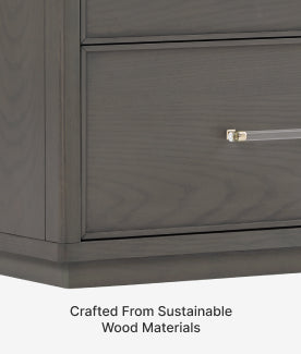 Gray wooden drawer with a gold handle, featuring text 'Crafted From Sustainable Wood Materials'.