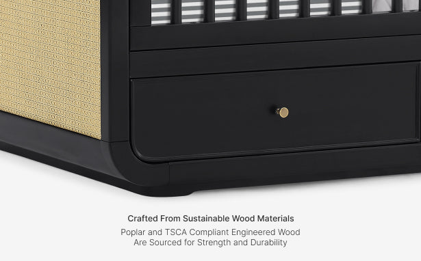 Black wooden drawer with a gold handle on a white background, featuring text about sustainable wood materials.