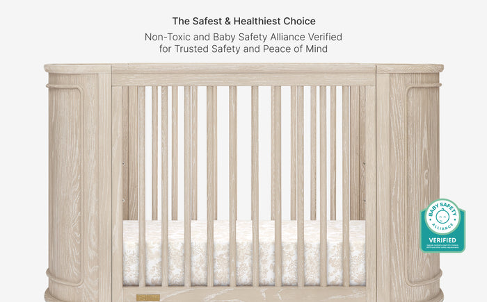 Wooden crib with safety bars and certification logo on a white background