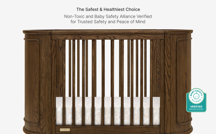 Wooden crib with safety certification label on a white background