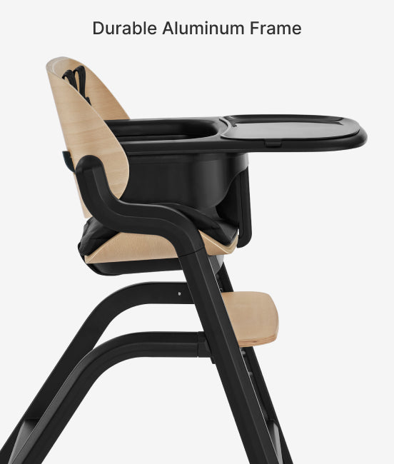 Black and beige high chair with durable aluminum frame on a white background