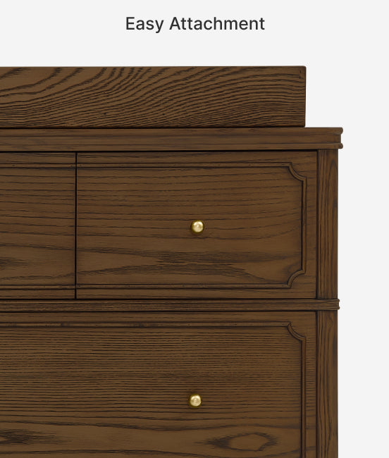 Wooden drawer with gold knobs on a white background