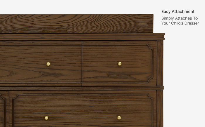 Wooden dresser with gold knobs on a white background