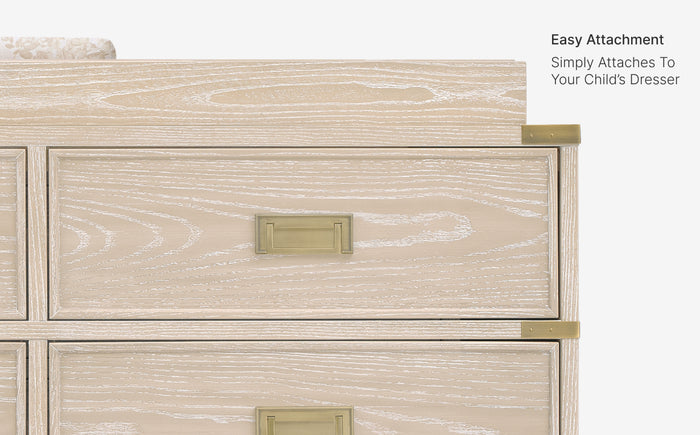 Wooden dresser with gold hardware on a white background