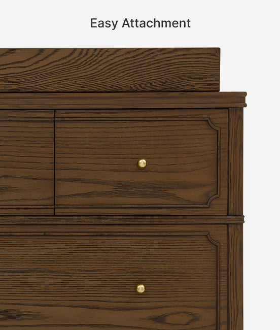 Wooden drawer with gold knobs on a white background