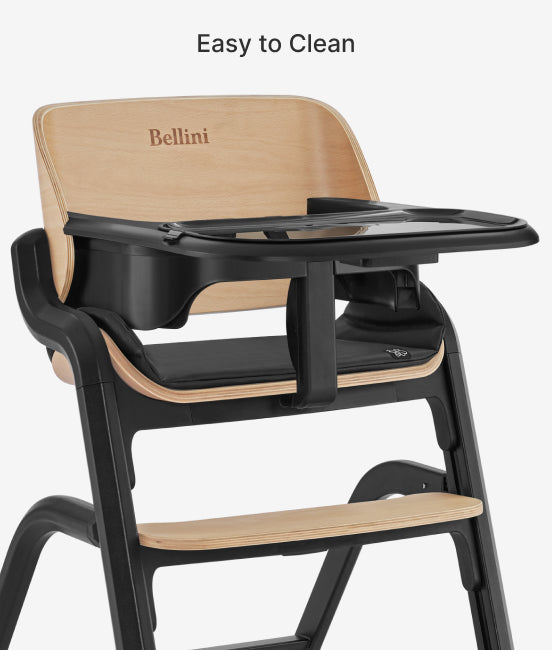 High chair with black tray and beige backrest, featuring the brand 'Bellini'.