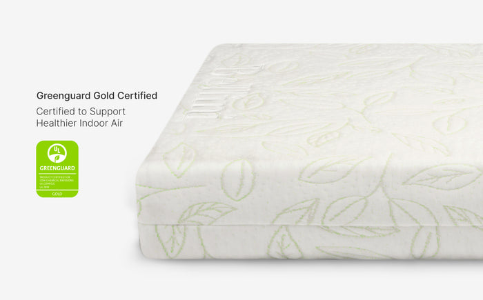 Mattress with leaf pattern and Greenguard Gold certification label on a white background