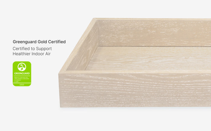 Wooden frame with Greenguard Gold certification label on a white background