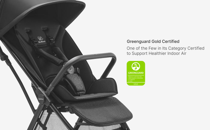 Black stroller with Greenguard Gold certification label on a white background