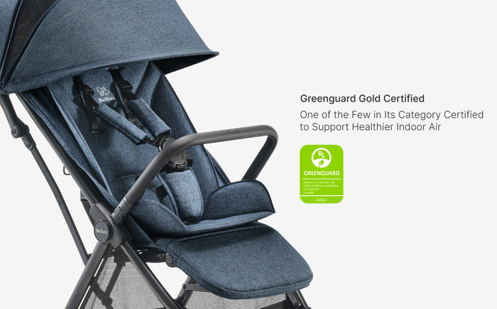 Blue stroller with Greenguard Gold certification label on a white background