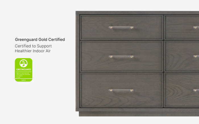 Gray dresser with four drawers and Greenguard Gold certification label on a white background