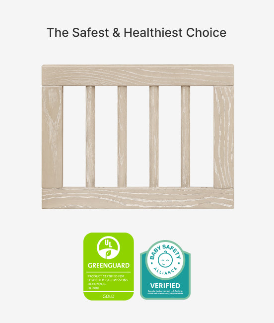 Wooden crib with Greenguard and Baby Safety Alliance certification logos on a white background