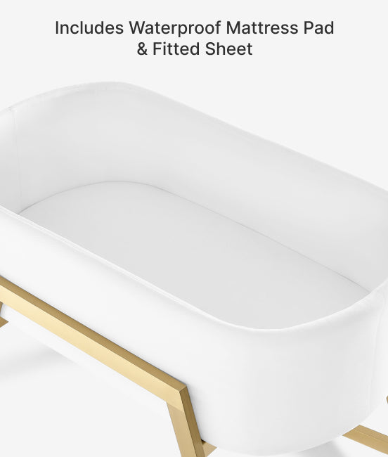 White mattress pad with gold trim on a white background
