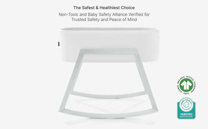 White baby crib with safety certification logo on a white background
