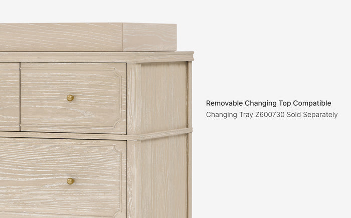 Wooden dresser with text indicating a removable changing top and compatible changing tray.