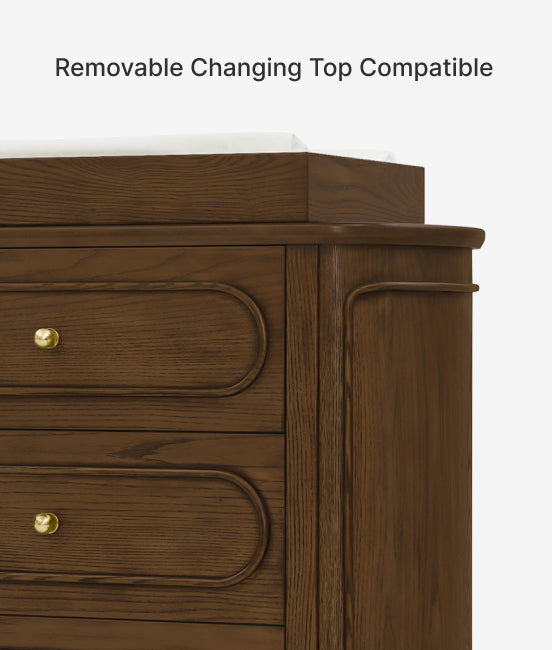 Wooden dresser with gold knobs on a white background
