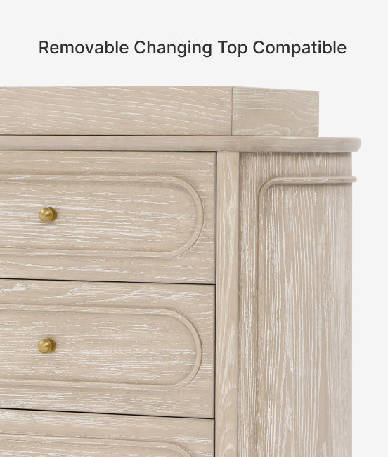 Wooden dresser with a removable changing top feature on a light gray background