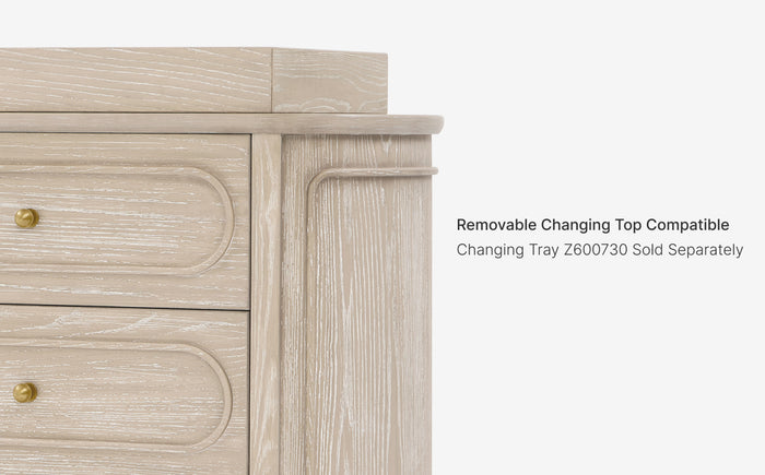 Wooden dresser with text indicating a removable changing top is compatible, with a separate tray sold separately.