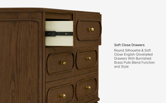 Wooden dresser with soft close drawers and brass pulls on a white background