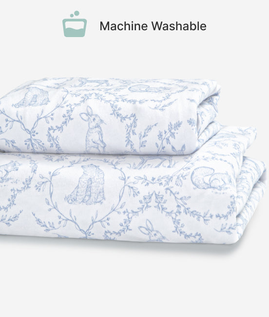 Folded fabric with blue floral pattern on a white background, labeled 'Machine Washable'.