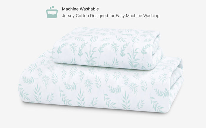 Folded fabric with a leaf pattern on a white background