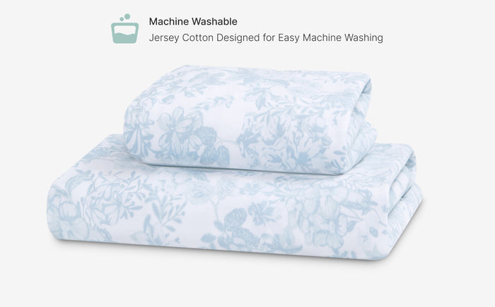 Floral patterned bedding set on a white background with machine washable text.