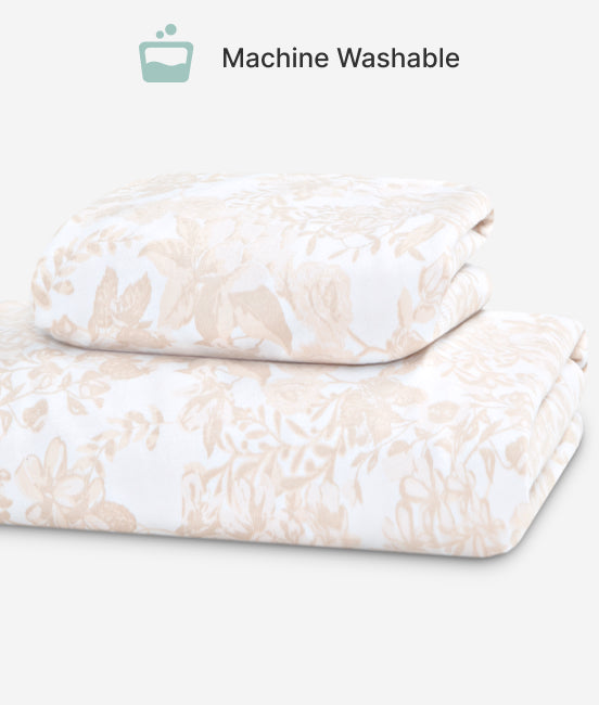 Floral-patterned comforter set with 'Machine Washable' label on a white background