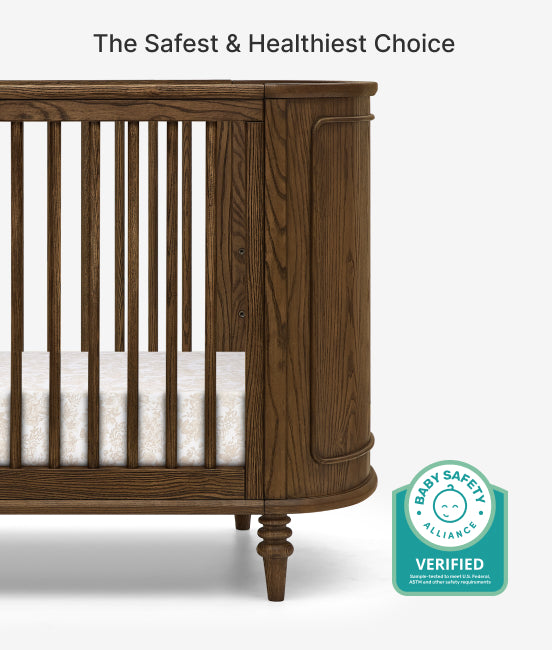 Wooden crib with Baby Safety Alliance verified badge on a white background
