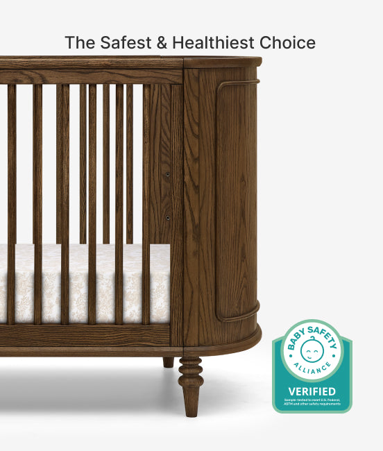 Wooden crib with Baby Safety Alliance verified badge on a white background