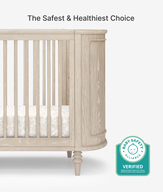 Wooden crib with Baby Safety Alliance verified badge on a white background