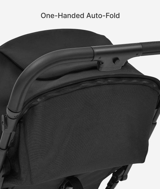 Close-up of a black stroller with 'One-Handed Auto-Fold' text on a white background