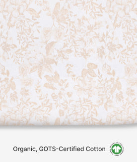 Close-up of organic, GOTS-certified cotton fabric with a subtle pattern.