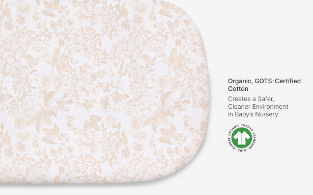 Close-up of organic cotton material with GOTS certification logo on a white background